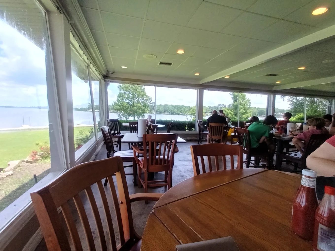 Lakeview porch seating at Orlandeaux's Café overlooking Cross Lake